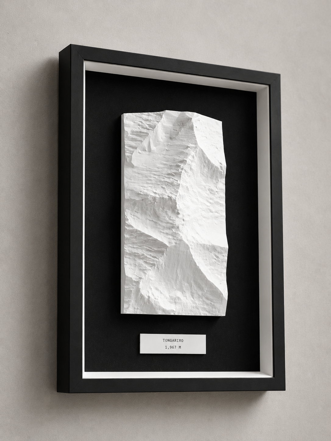 A framed white topographic relief of Tongariro
